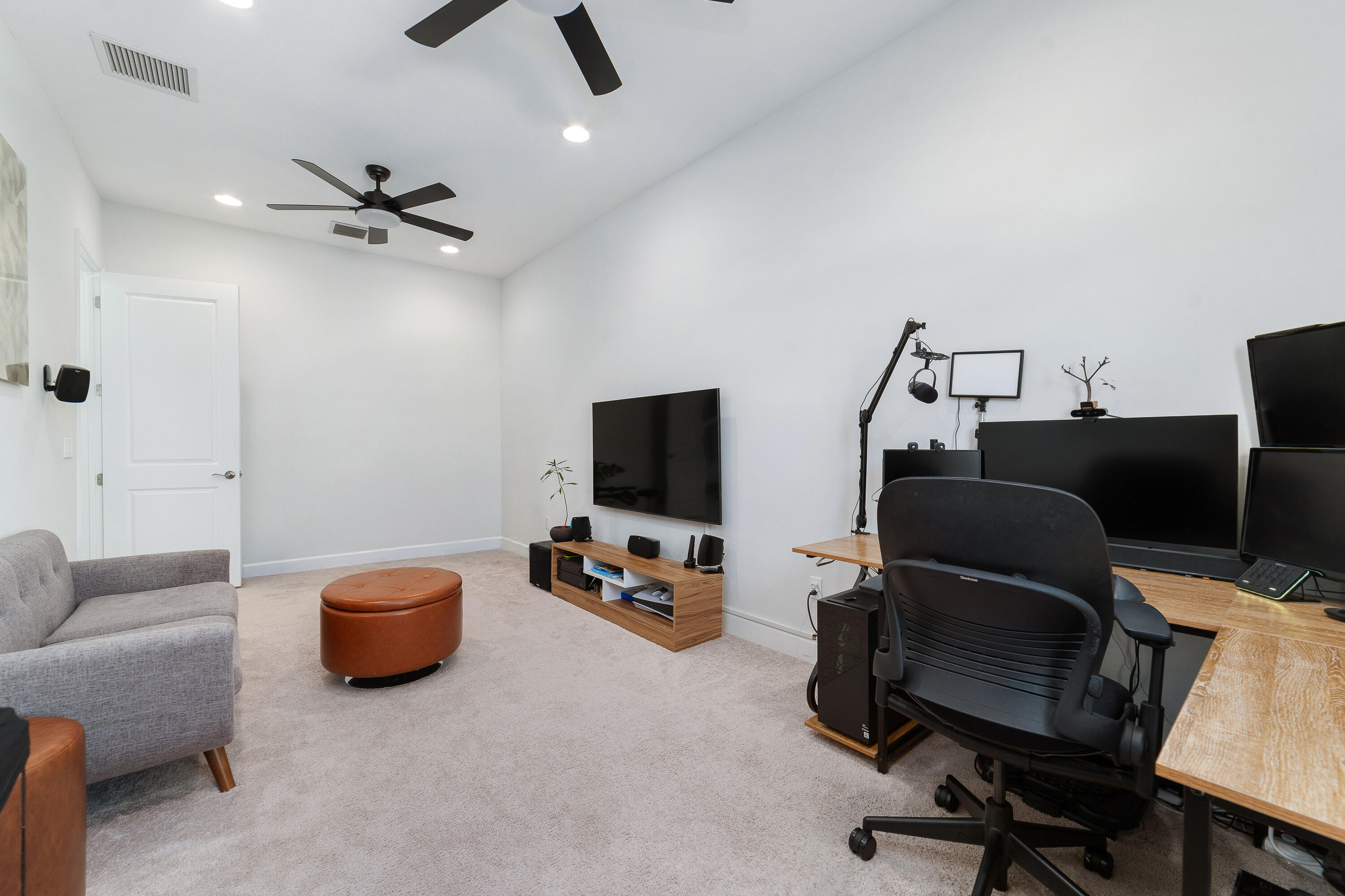 5487 Macoon Way Loxahatchee, FL 33470 - Photo 24 of 66 a view of a livingroom with workspace and a couch