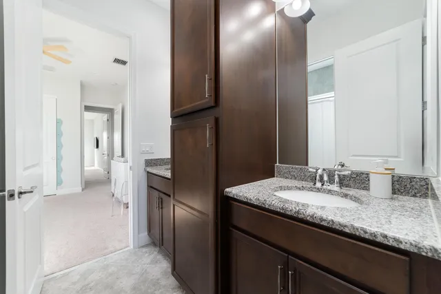 a spacious bedroom with a bed and a large window