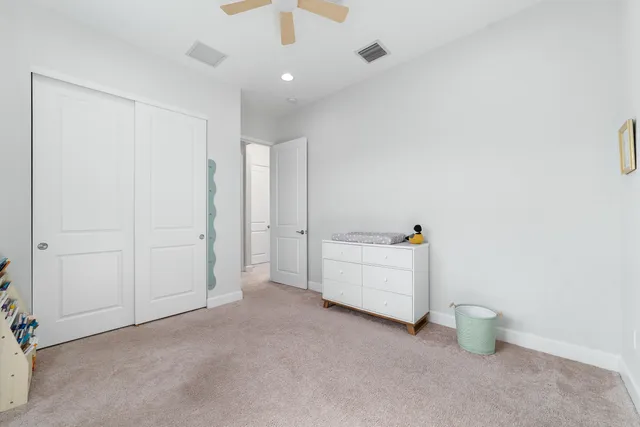 a view of a storage and utility room with washer and dryer