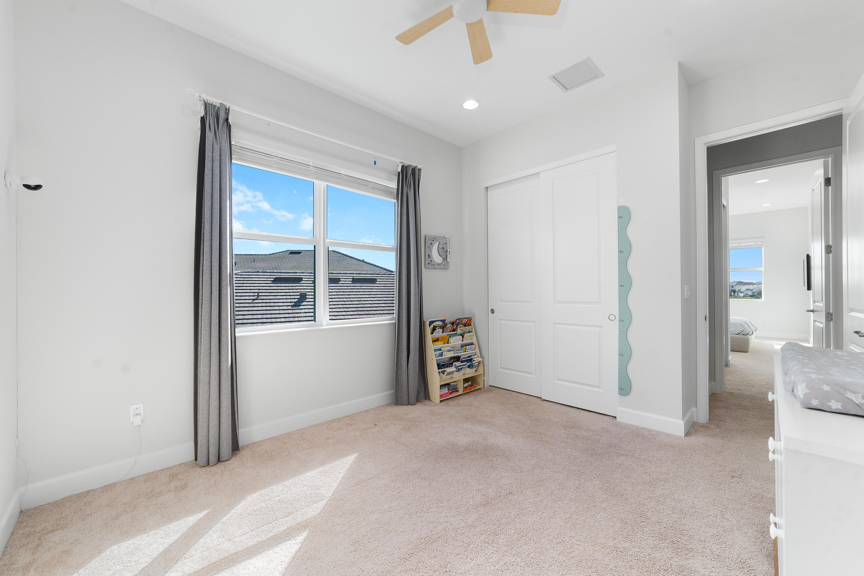 5487 Macoon Way Loxahatchee, FL 33470 - Photo 33 of 66 an empty room with fan and windows