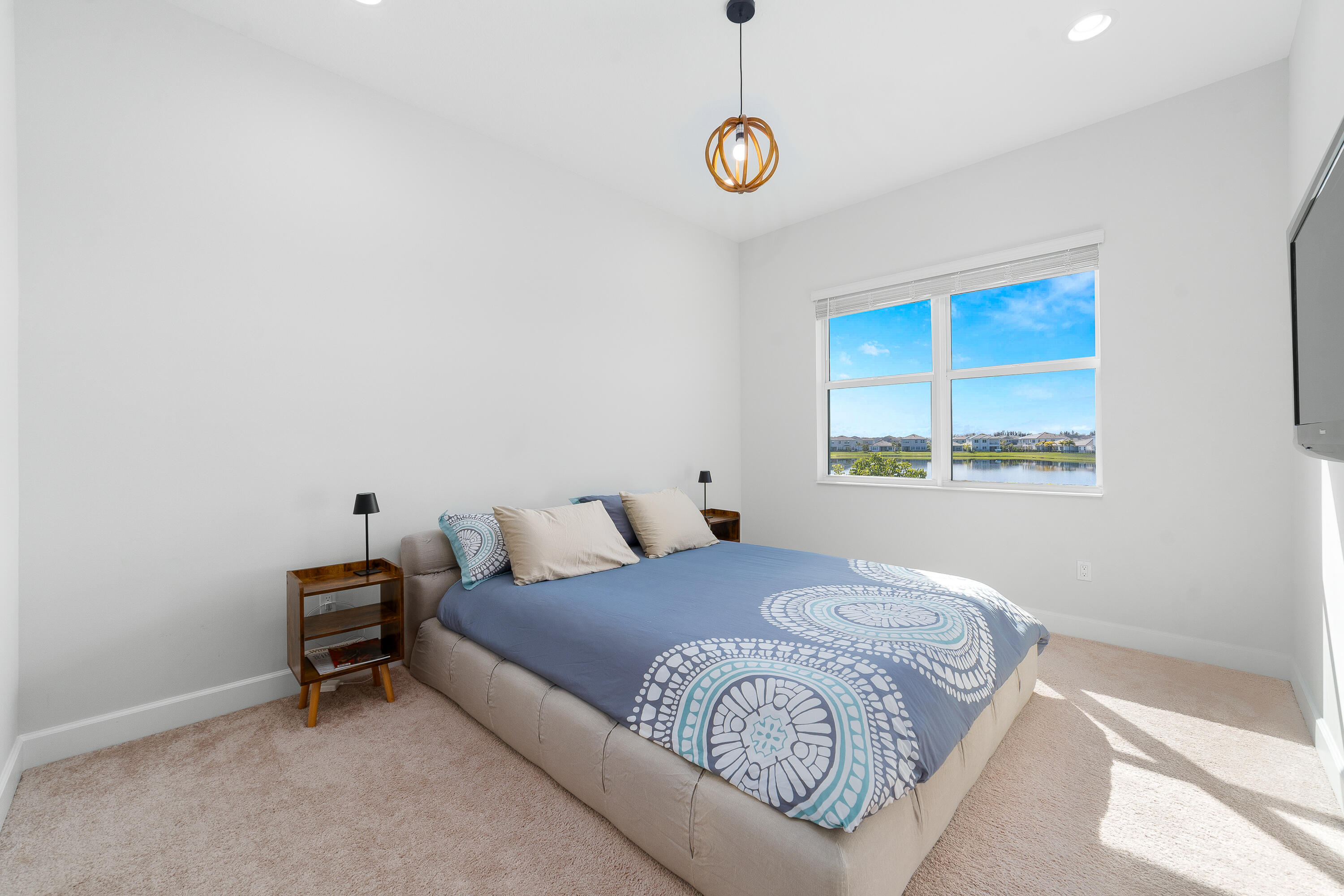 5487 Macoon Way Loxahatchee, FL 33470 - Photo 34 of 66 a bedroom with a bed and a window