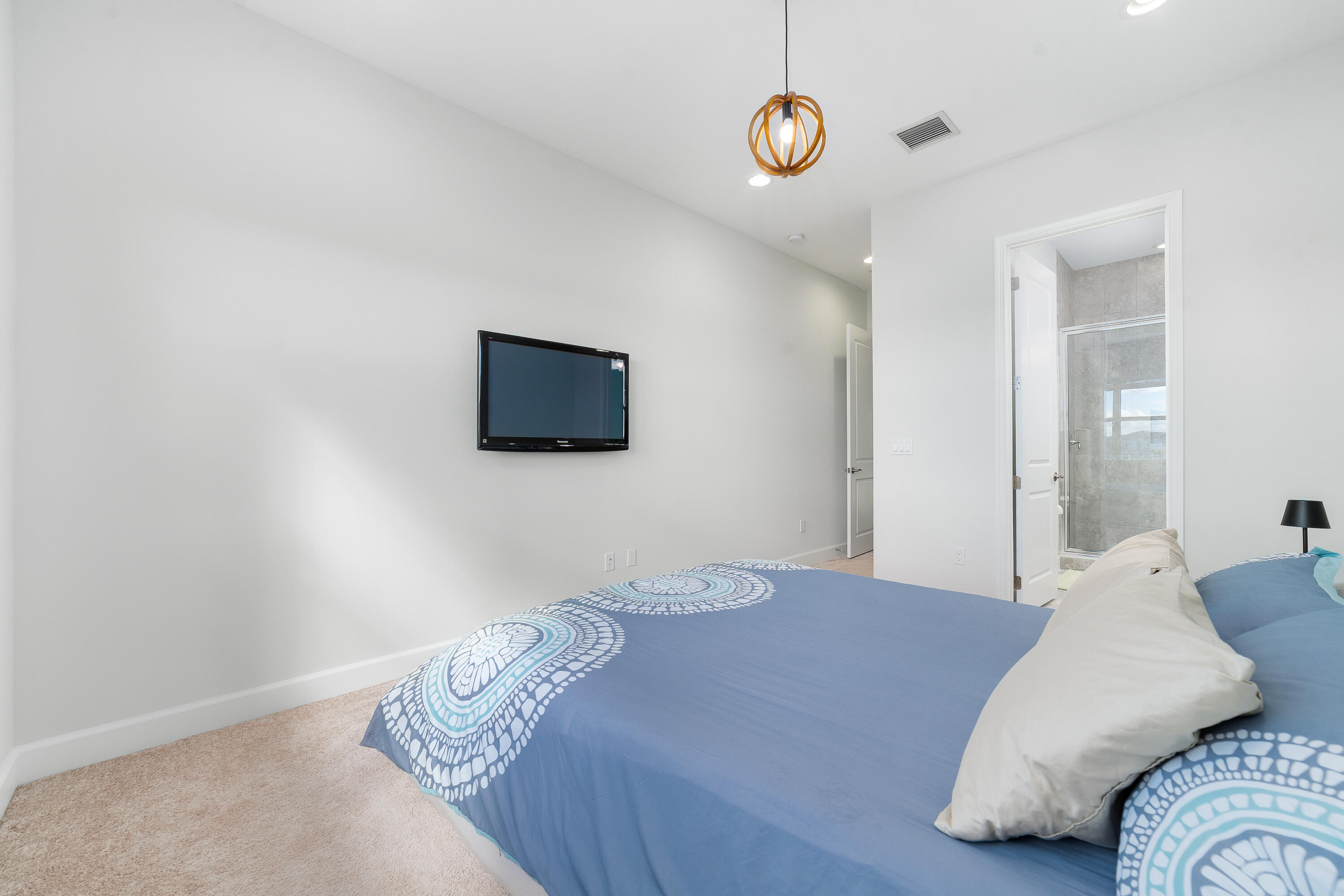 5487 Macoon Way Loxahatchee, FL 33470 - Photo 36 of 66 a bedroom with a bed and a flat screen tv