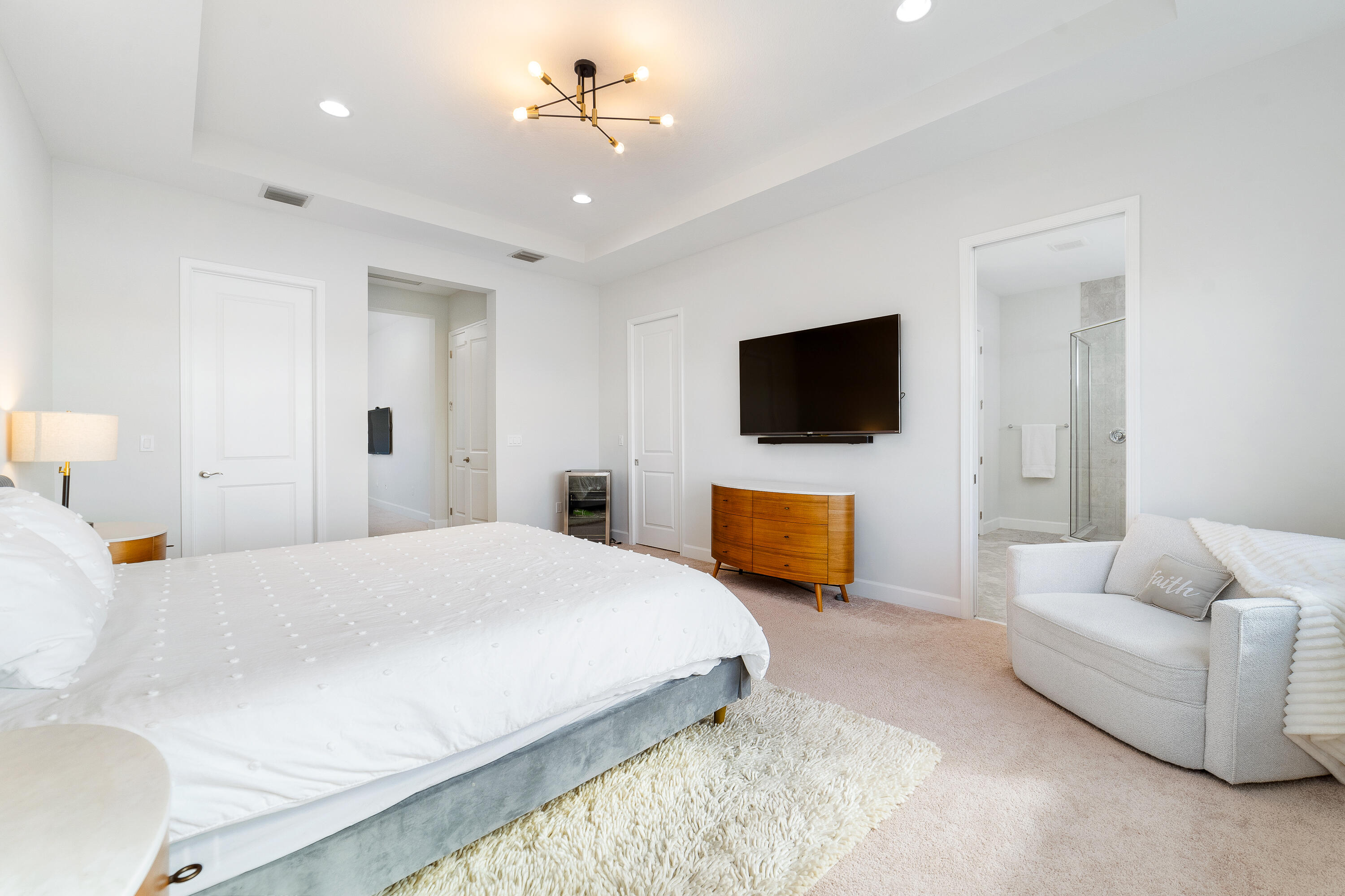 5487 Macoon Way Loxahatchee, FL 33470 - Photo 43 of 66 a bedroom with a bed furniture and a flat screen tv