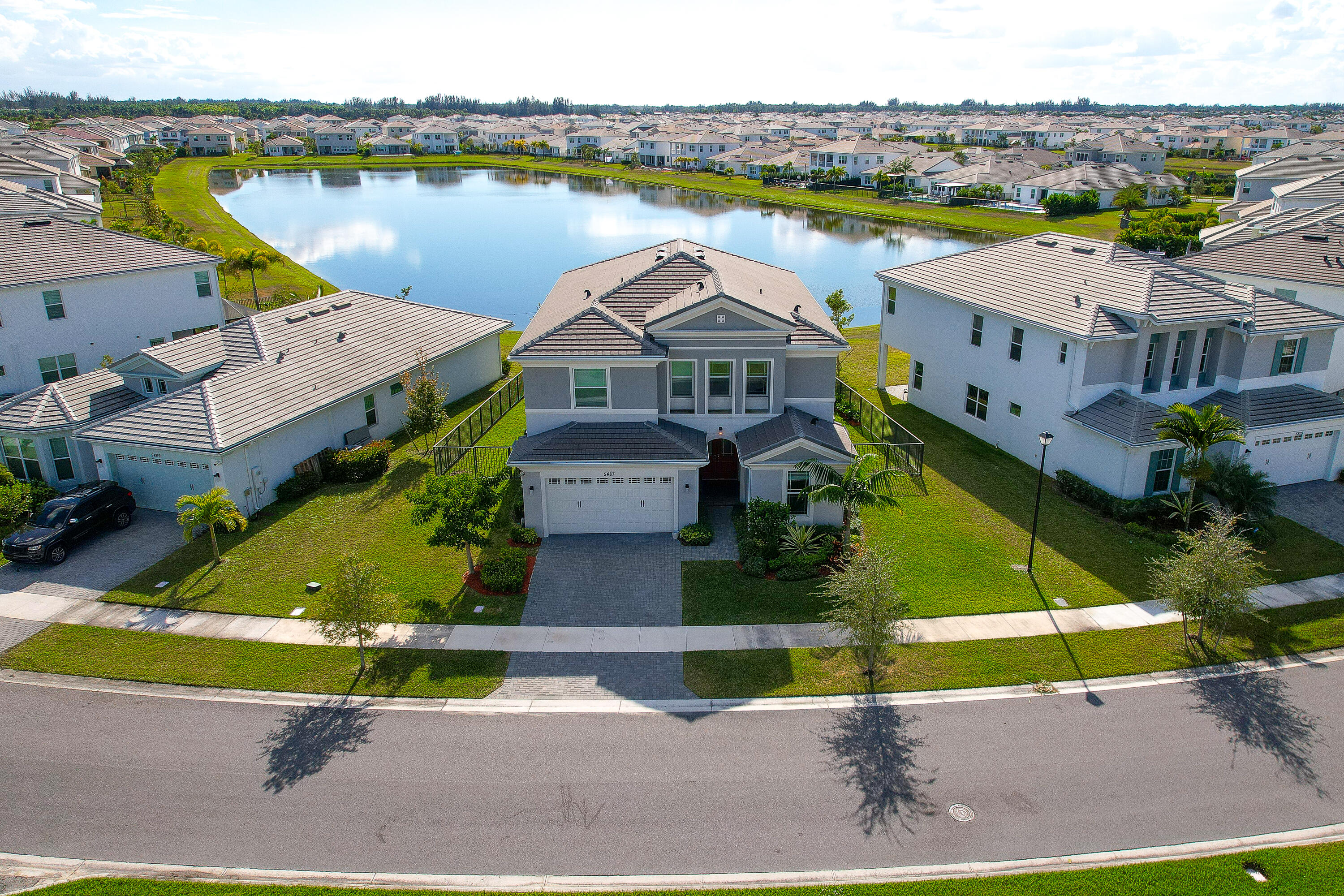 5487 Macoon Way Loxahatchee, FL 33470 - Photo 58 of 66 an aerial view of a house with a lake view