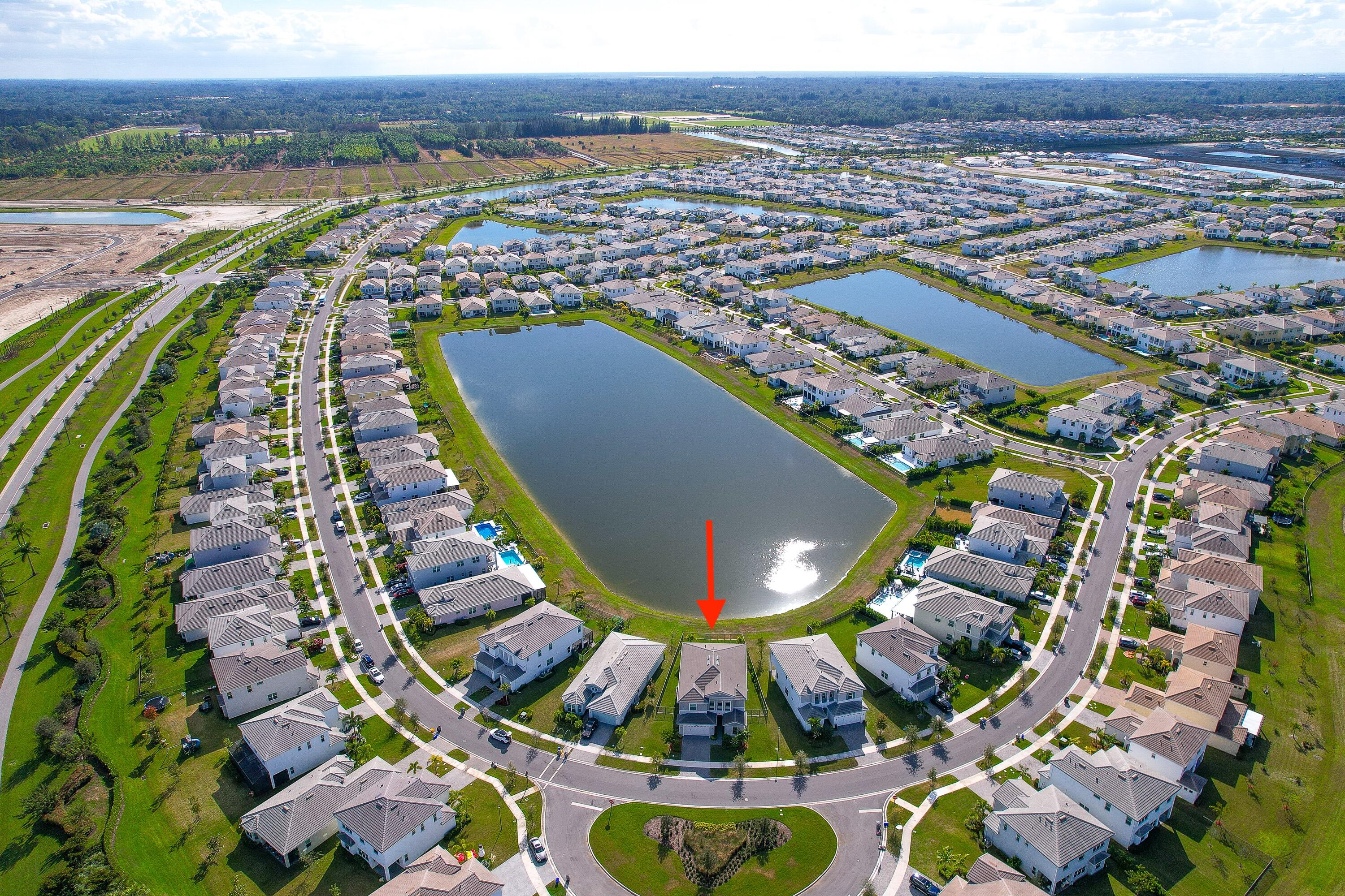 5487 Macoon Way Loxahatchee, FL 33470 - Photo 60 of 66 an aerial view of residential houses with outdoor space