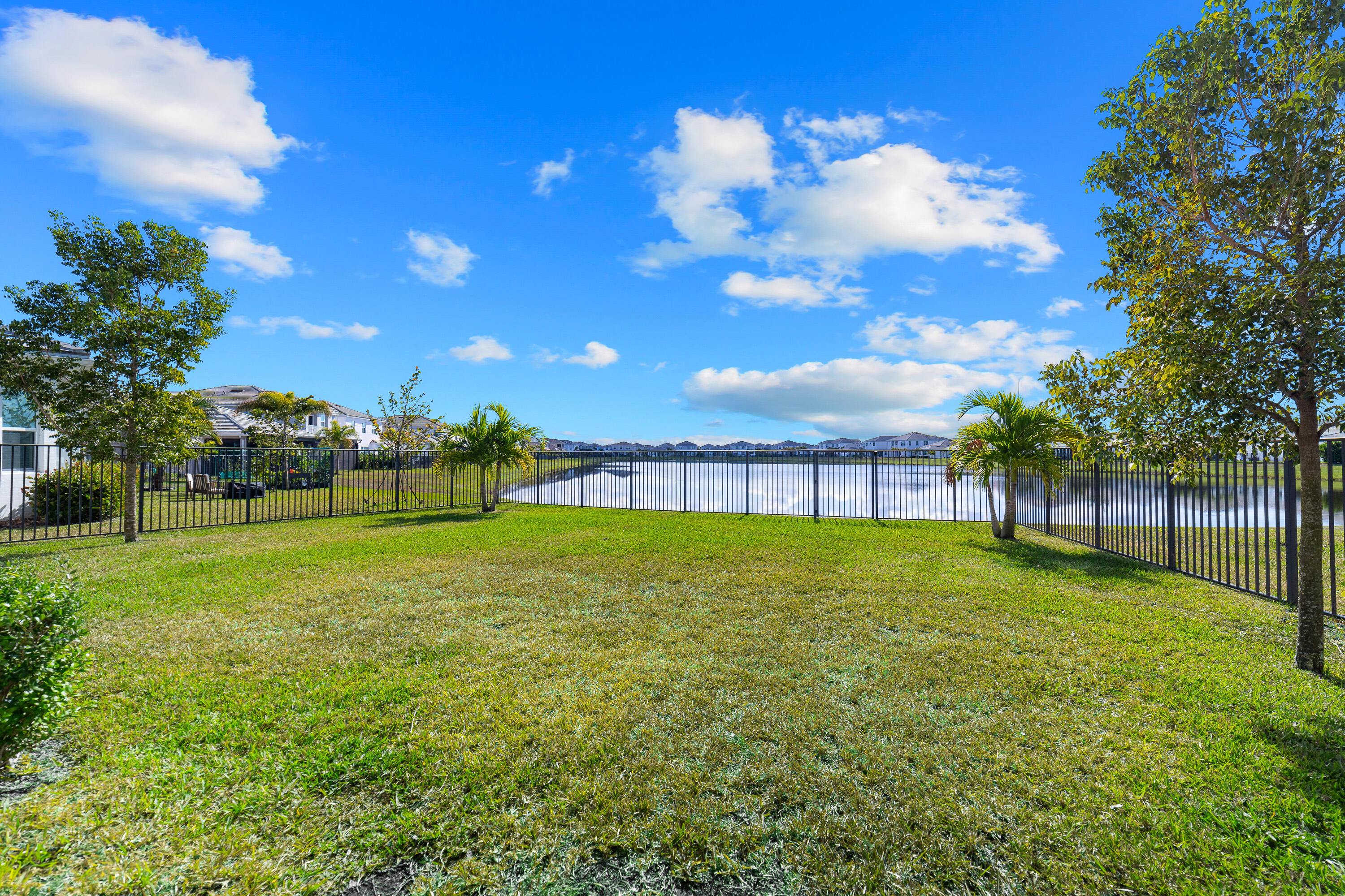 5487 Macoon Way Loxahatchee, FL 33470 - Photo 6 of 66 a view of a field with a tree in the background