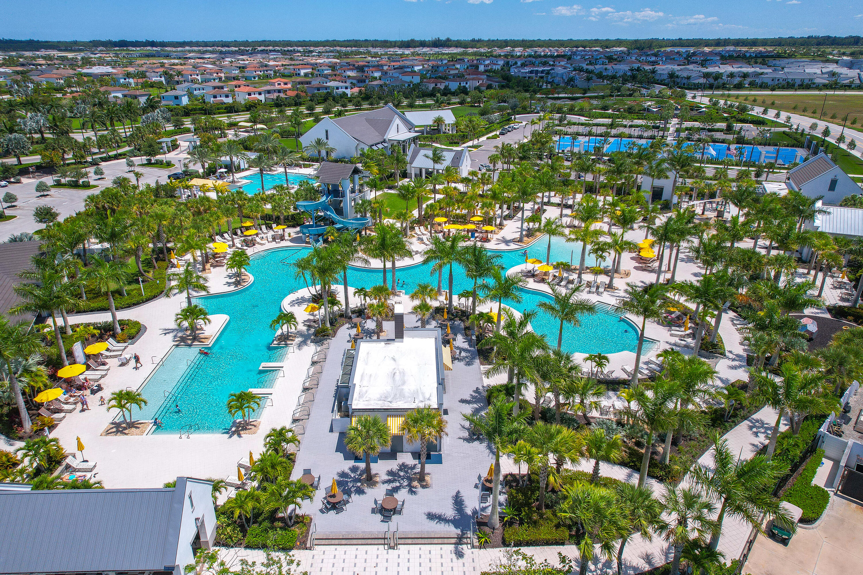 5487 Macoon Way Loxahatchee, FL 33470 - Photo 61 of 66 an aerial view of residential houses with outdoor space and swimming pool