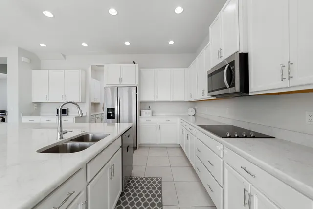 a living room with furniture a flat screen tv and a large window