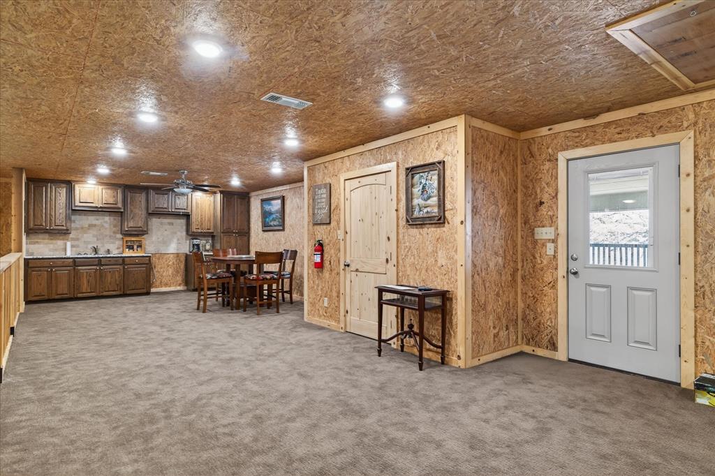 790 Bones Chapel Road Whitesboro, TX 76273 - Photo 36 of 39 a view of a livingroom with furniture and a refrigerator