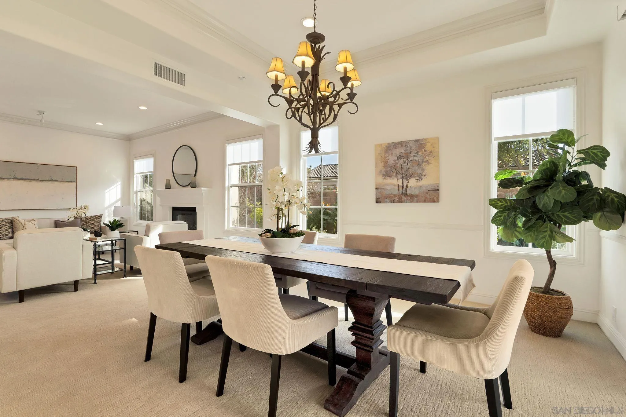 698 Cypress Hills Drive Encinitas, CA 92024 - Photo 11 of 44 a view of a dining room with furniture and a chandelier