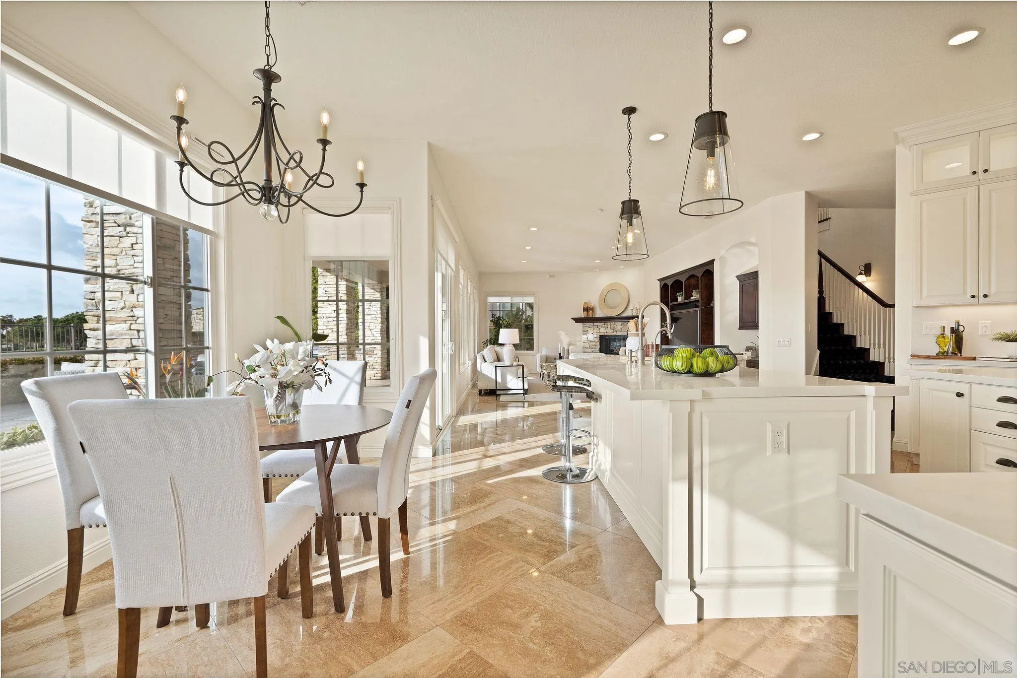 698 Cypress Hills Drive Encinitas, CA 92024 - Photo 12 of 44 a view of a dining room and livingroom with furniture wooden floor a chandelier