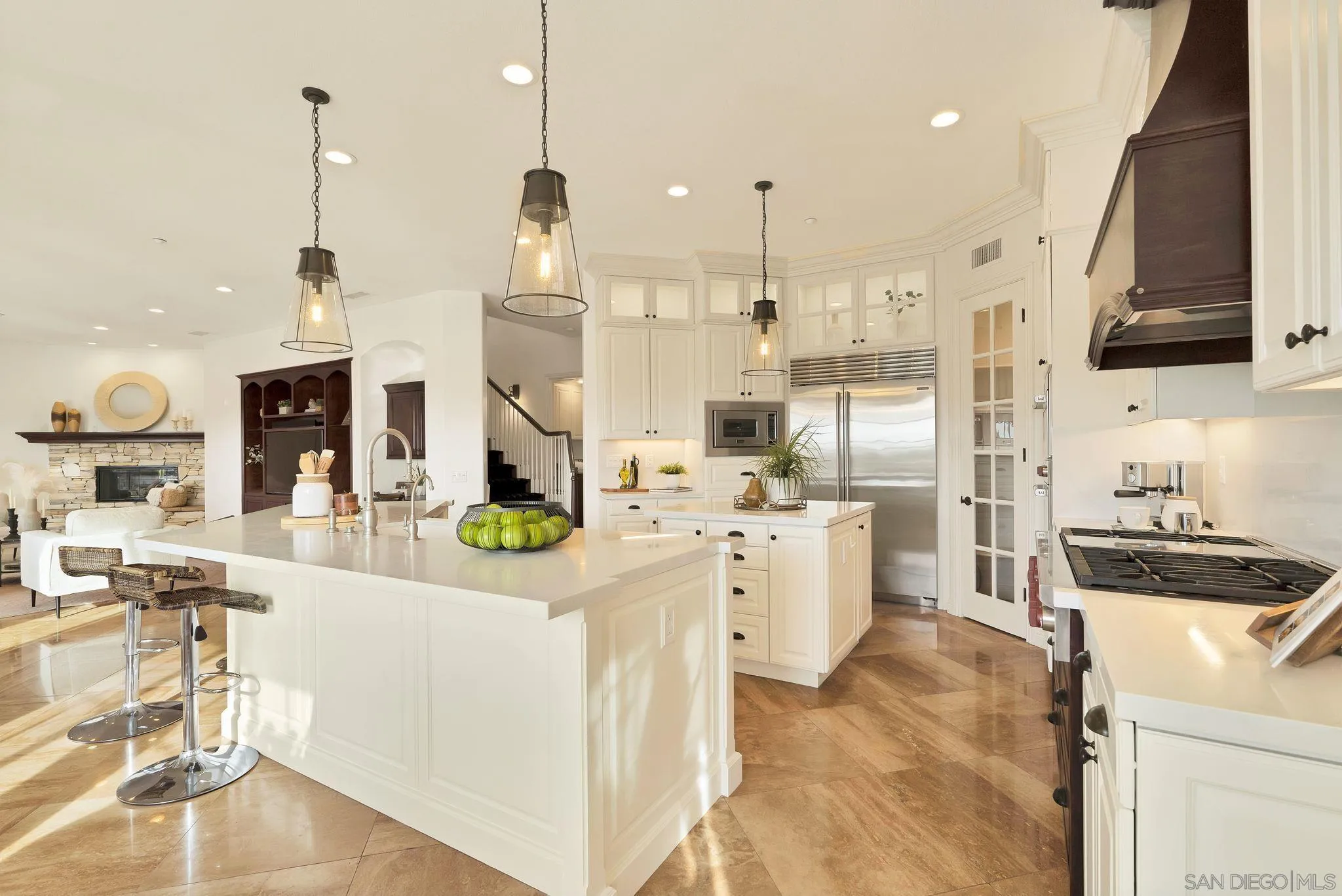 698 Cypress Hills Drive Encinitas, CA 92024 - Photo 13 of 44 a kitchen with stainless steel appliances kitchen island granite countertop a sink and cabinets