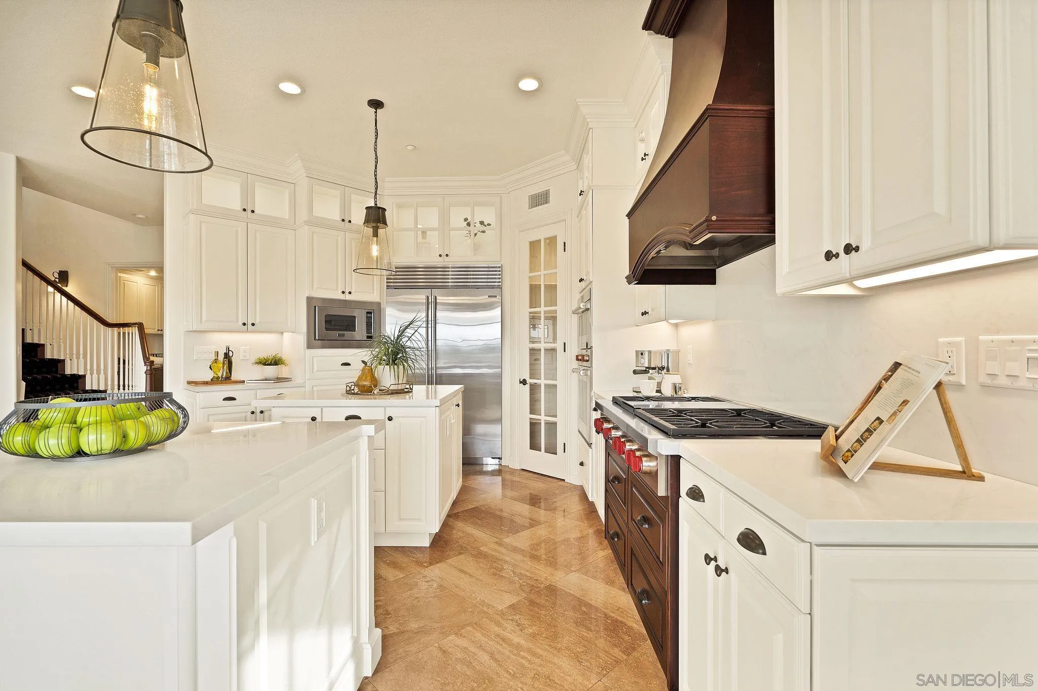 698 Cypress Hills Drive Encinitas, CA 92024 - Photo 14 of 44 a kitchen with kitchen island stainless steel appliances a stove a sink and a refrigerator