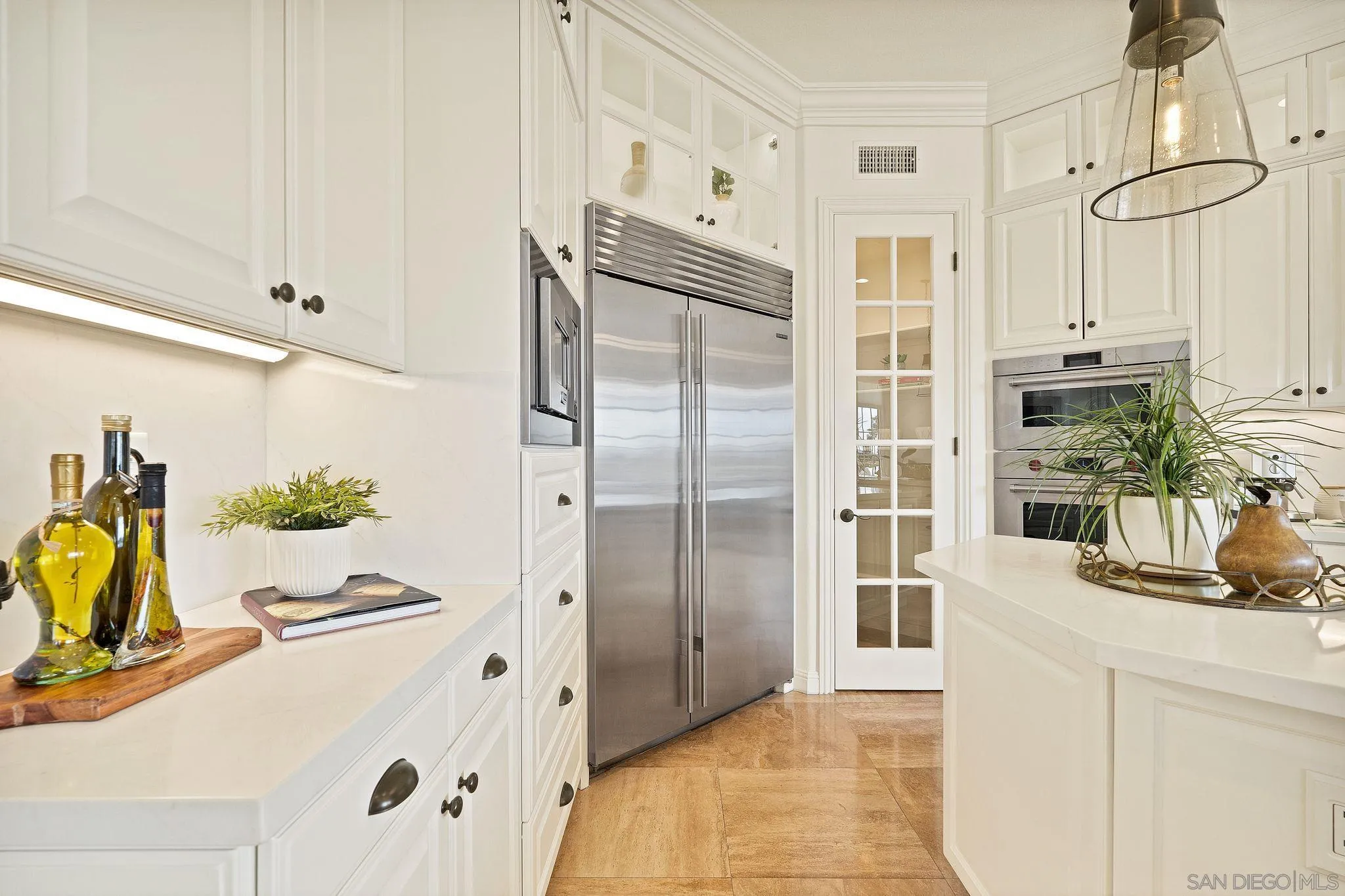 698 Cypress Hills Drive Encinitas, CA 92024 - Photo 16 of 44 a kitchen with a refrigerator and countertop