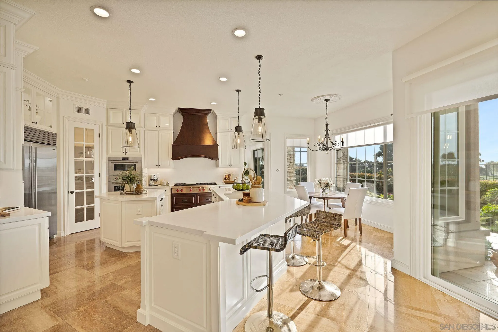 698 Cypress Hills Drive Encinitas, CA 92024 - Photo 17 of 44 a living room with stainless steel appliances kitchen island granite countertop furniture and a fireplace