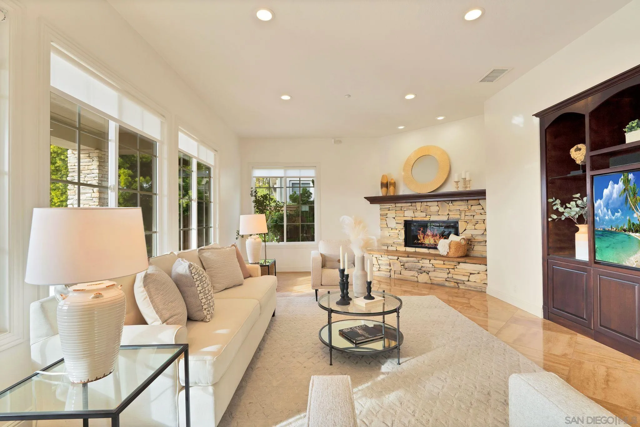 698 Cypress Hills Drive Encinitas, CA 92024 - Photo 20 of 44 a living room with furniture a fireplace and a flat screen tv