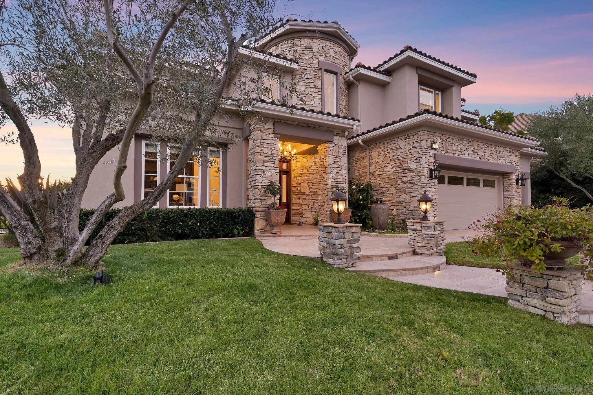 698 Cypress Hills Drive Encinitas, CA 92024 - Photo 2 of 44 a front view of a house with a garden and plants