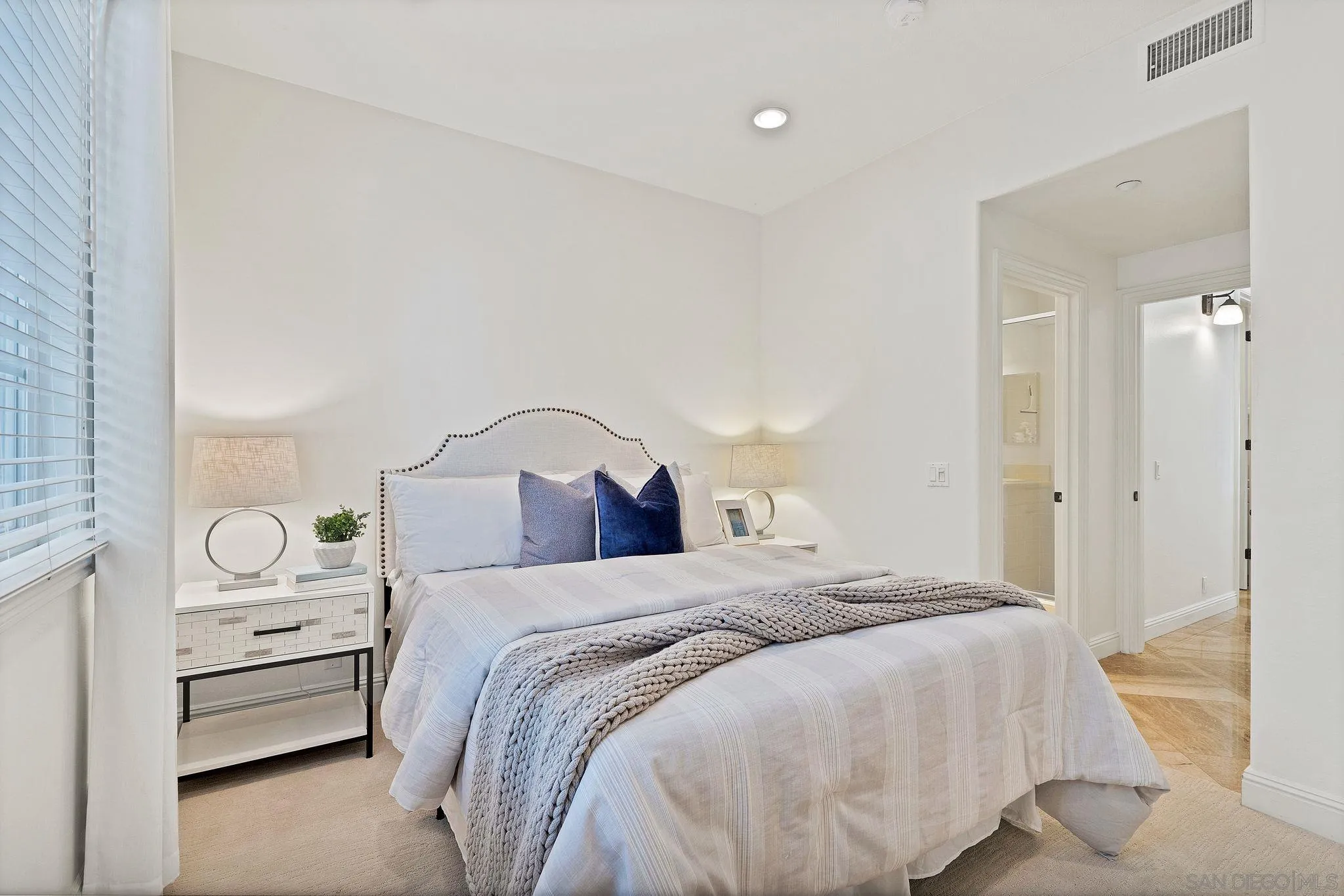 698 Cypress Hills Drive Encinitas, CA 92024 - Photo 22 of 44 a bedroom with a bed and a lamp