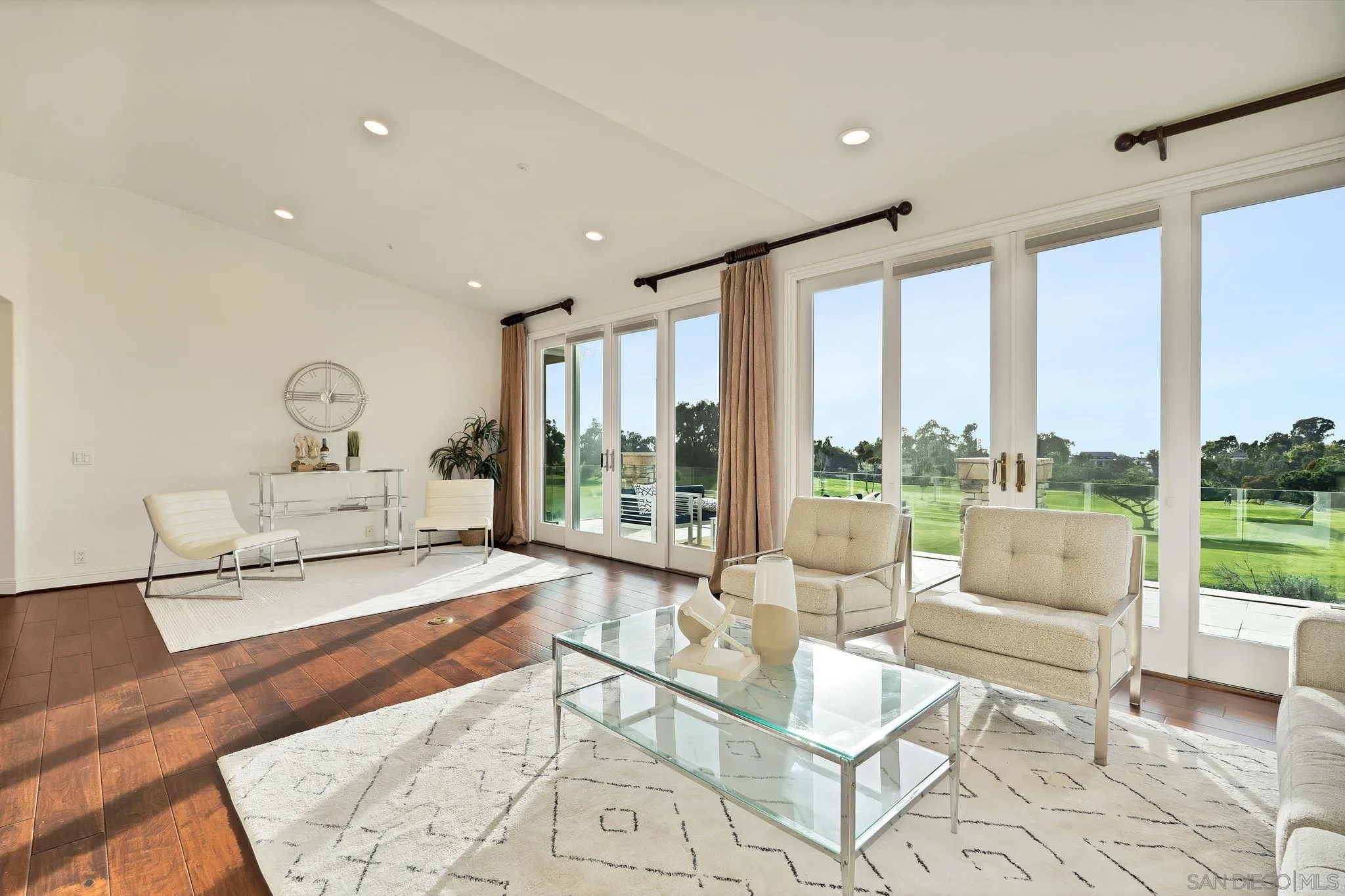 698 Cypress Hills Drive Encinitas, CA 92024 - Photo 24 of 44 a living room with furniture and a floor to ceiling window