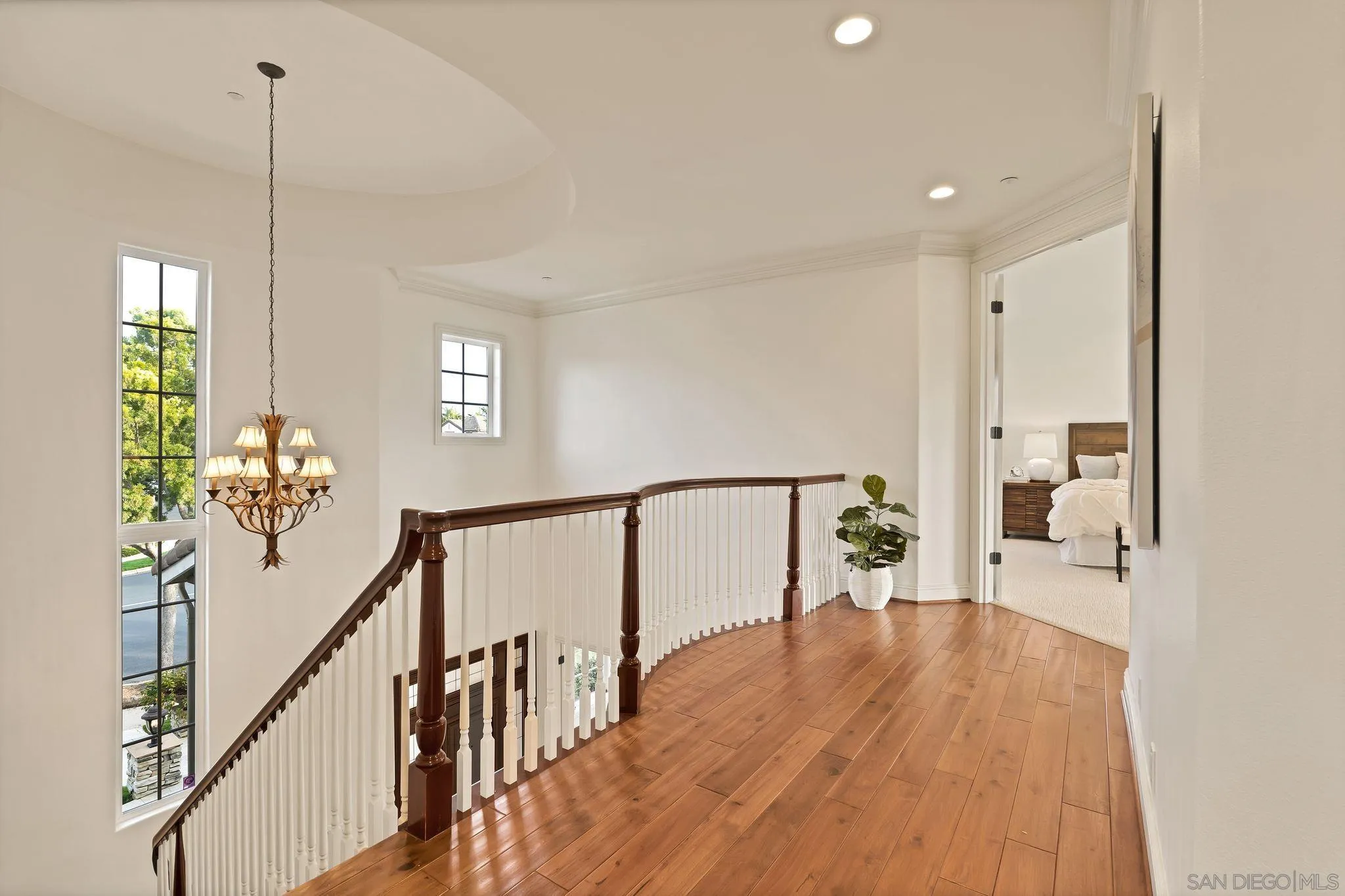 698 Cypress Hills Drive Encinitas, CA 92024 - Photo 27 of 44 a way to livingroom with wooden floor and stairs