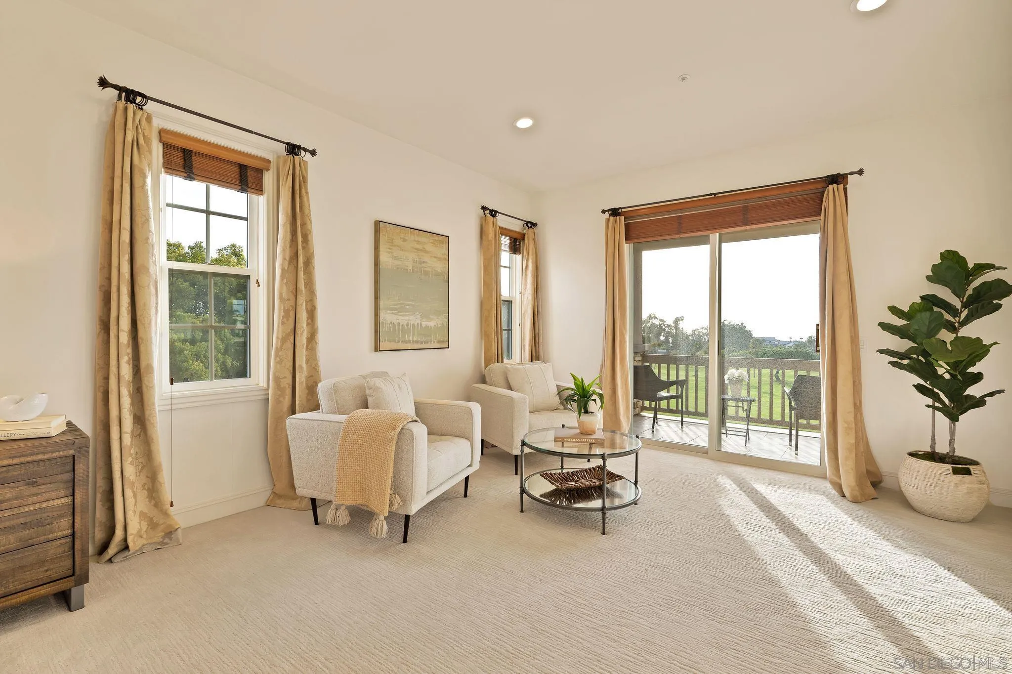 698 Cypress Hills Drive Encinitas, CA 92024 - Photo 30 of 44 a living room with furniture and a floor to ceiling window