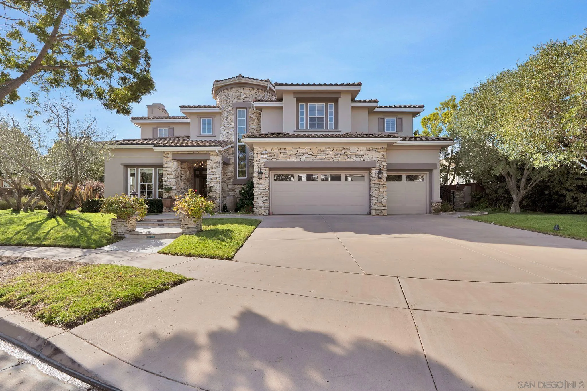 698 Cypress Hills Drive Encinitas, CA 92024 - Photo 3 of 44 a front view of a house with yard and green space