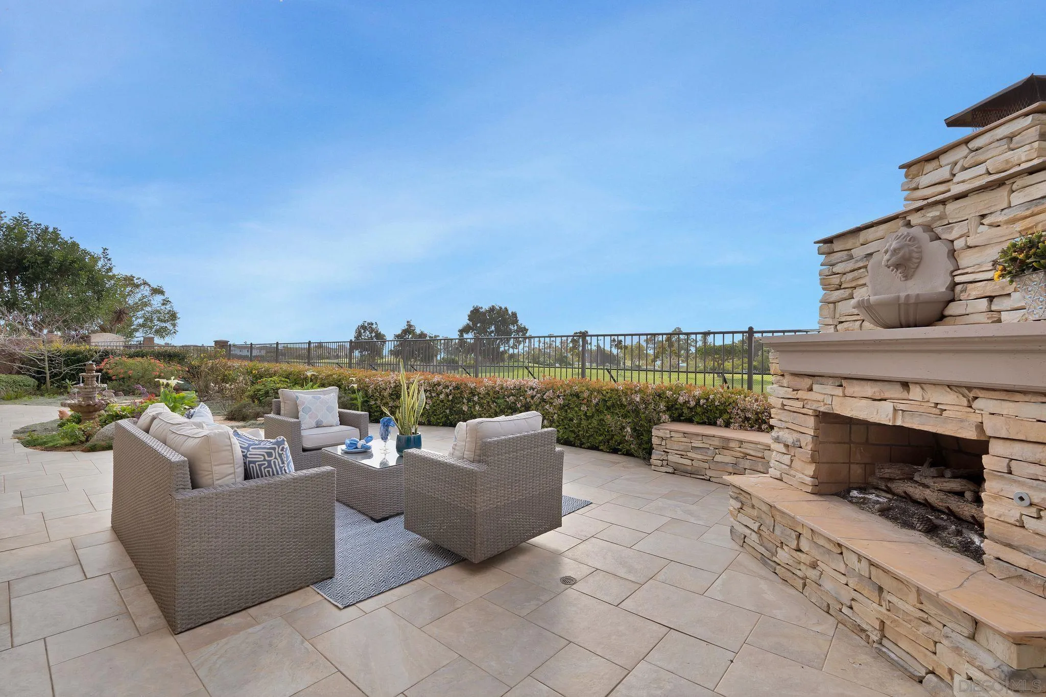 698 Cypress Hills Drive Encinitas, CA 92024 - Photo 38 of 44 a balcony with furniture and a fireplace