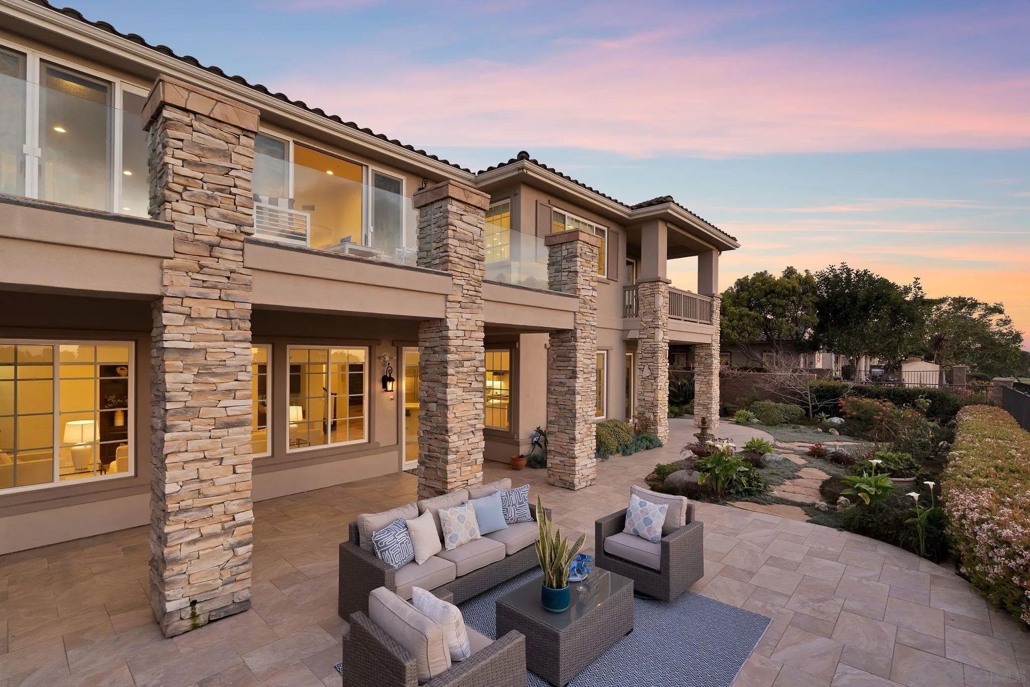 698 Cypress Hills Drive Encinitas, CA 92024 - Photo 40 of 44 a view of a house with a couches in a patio