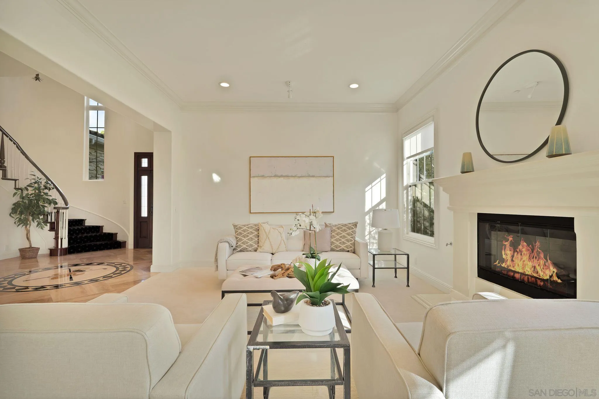 698 Cypress Hills Drive Encinitas, CA 92024 - Photo 9 of 44 a living room with furniture a mirror and a fireplace