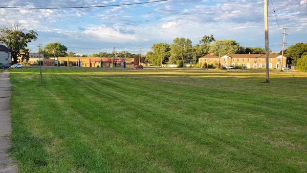 a view of a park with swings and slides