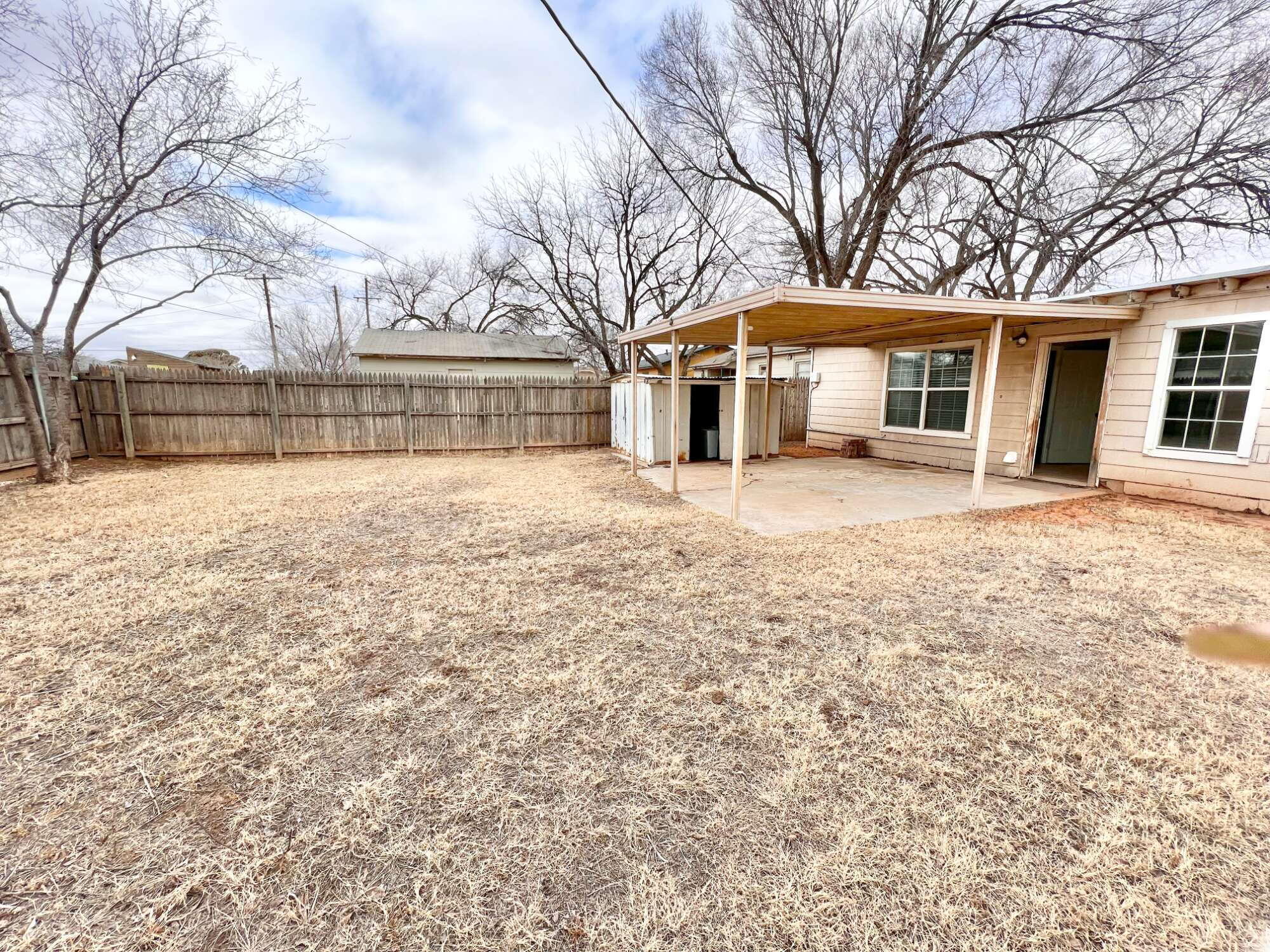 4819 35th Street Lubbock, TX 79414 - Photo 11 of 13 front view of a house with a yard