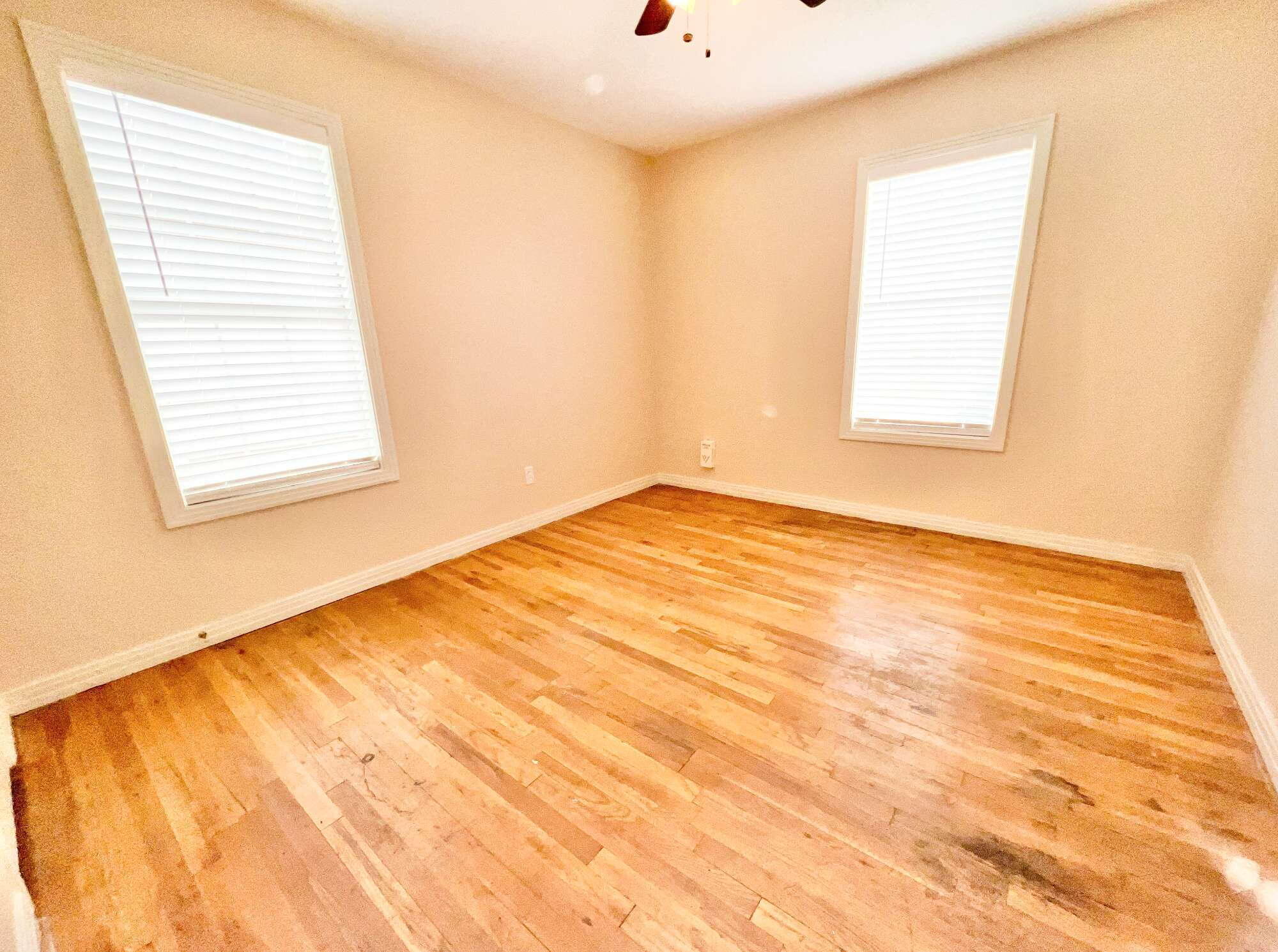 4819 35th Street Lubbock, TX 79414 - Photo 8 of 13 a view of an empty room and window