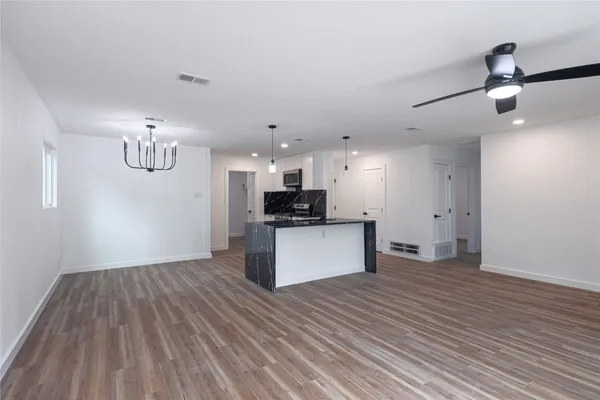 a view of kitchen and wooden floor