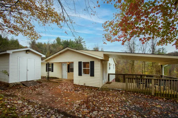 a house with a tree in the background