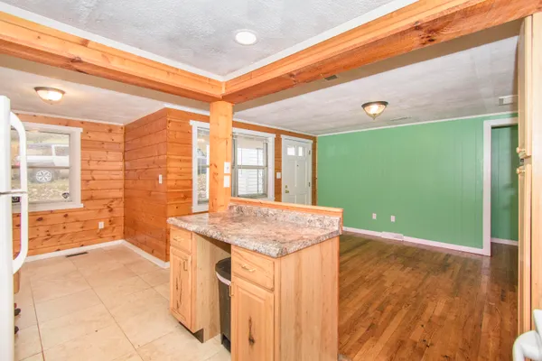 a kitchen with a sink and a large window