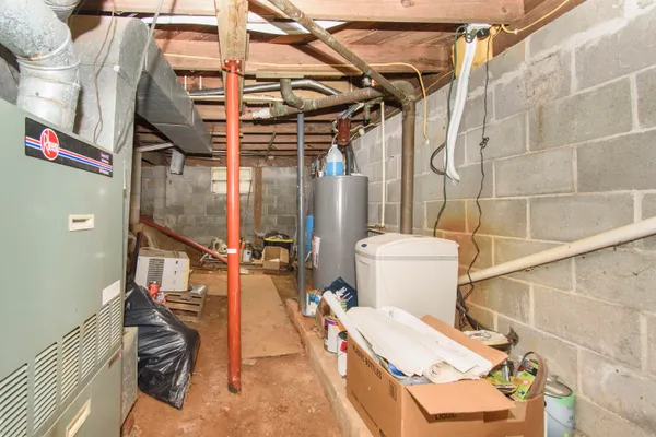 a view of a patio with a chairs and potted plants