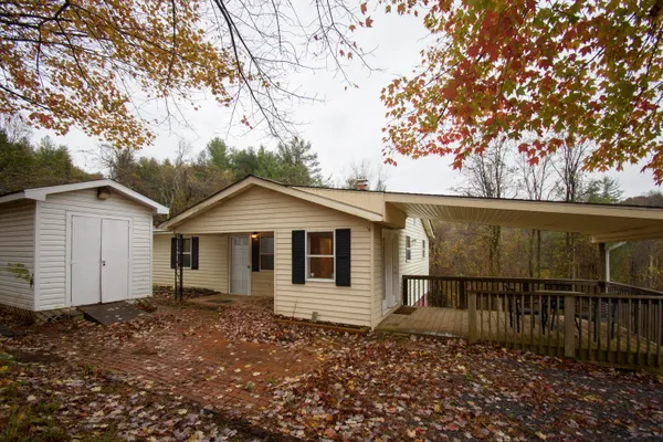 a house with a tree in the background