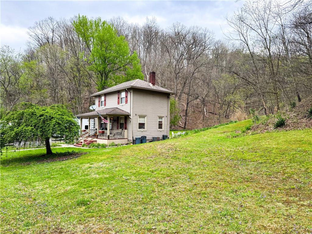 125 McGrew Road Clairton, PA 15025 - Photo 9 of 25 a view of a house with backyard and sitting area