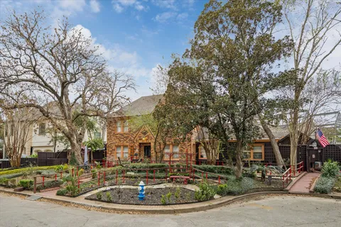 a view of a town with large trees