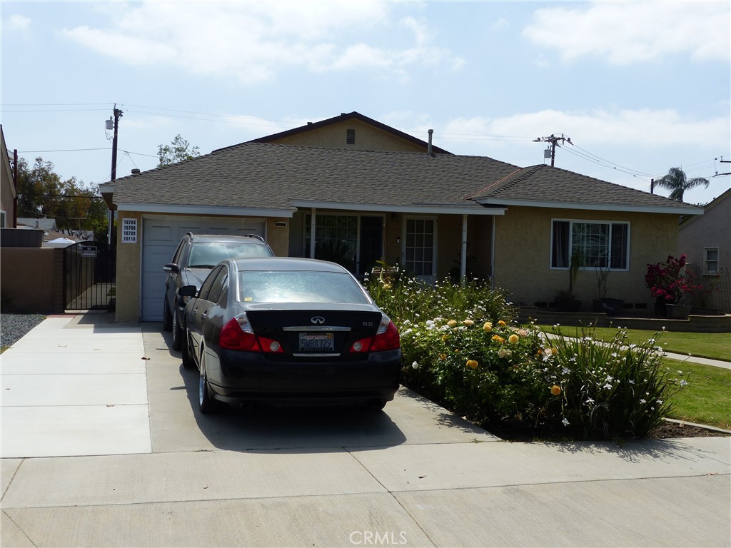 10708 Walnut Street Los Alamitos, CA 90720 - Photo 12 of 13 a front view of a house with a yard
