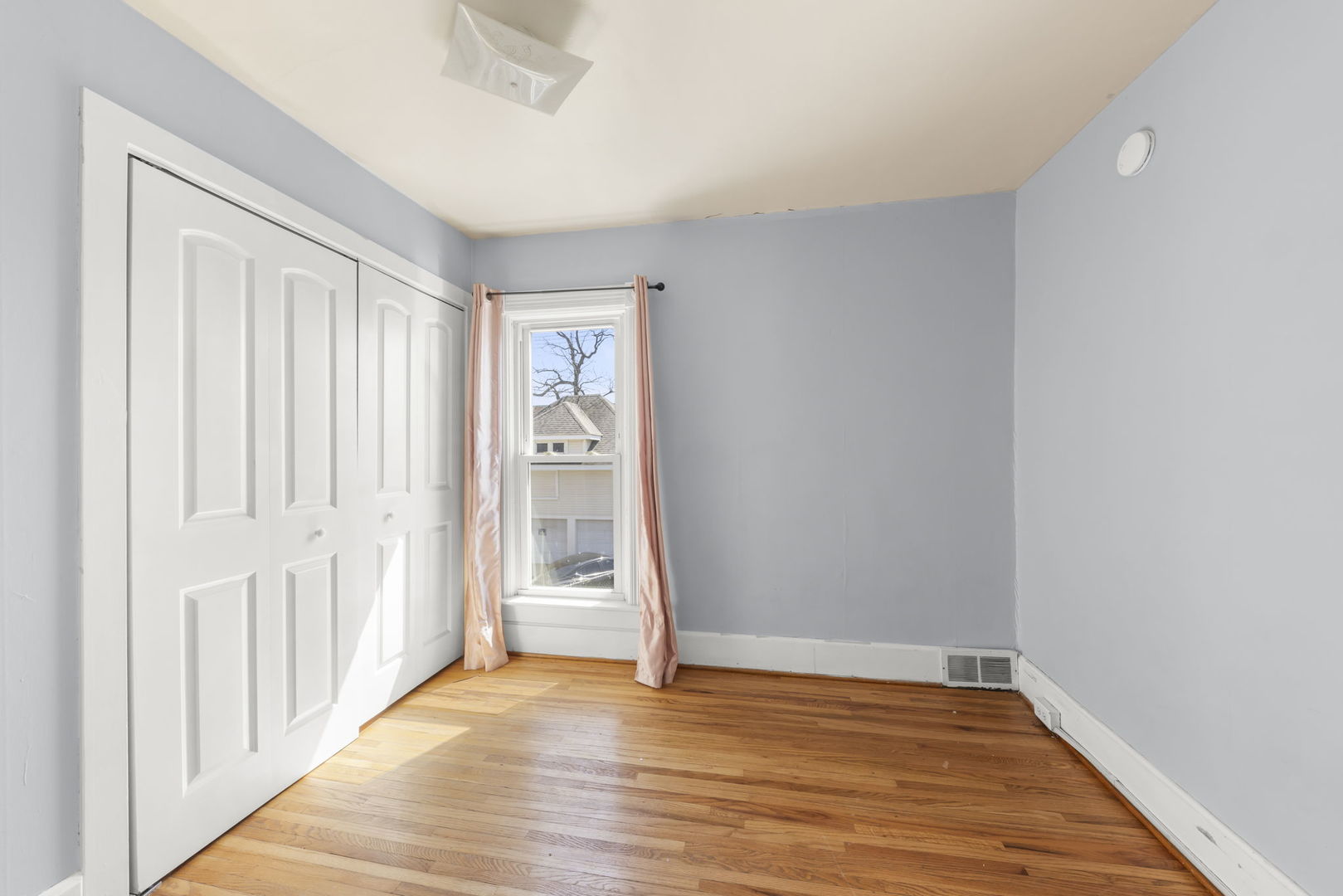208 West Locust Street DeKalb, IL 60115 - Photo 15 of 26 a view of an empty room with wooden floor