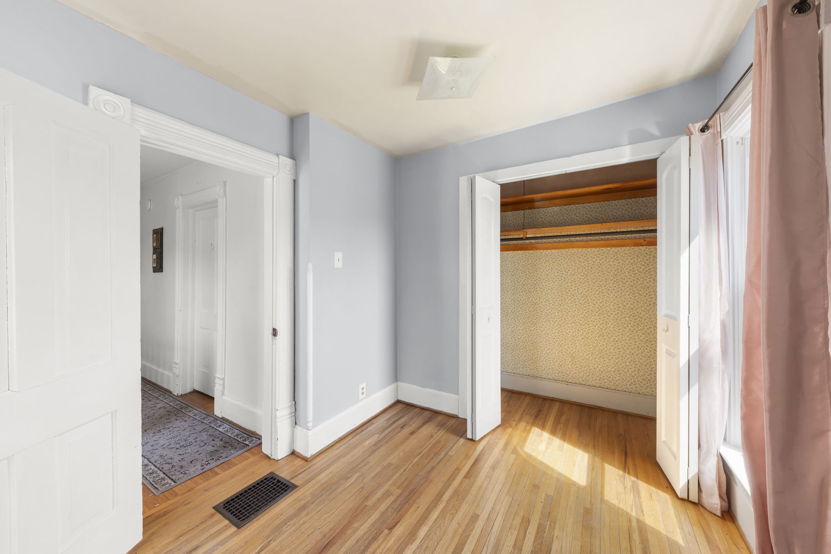 208 West Locust Street DeKalb, IL 60115 - Photo 17 of 26 a view of a room that has a bed in it
