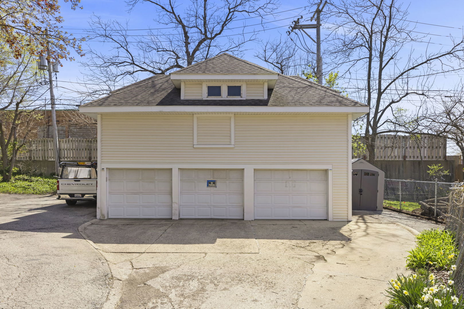 208 West Locust Street DeKalb, IL 60115 - Photo 23 of 26 a front view of a house with a yard and garage