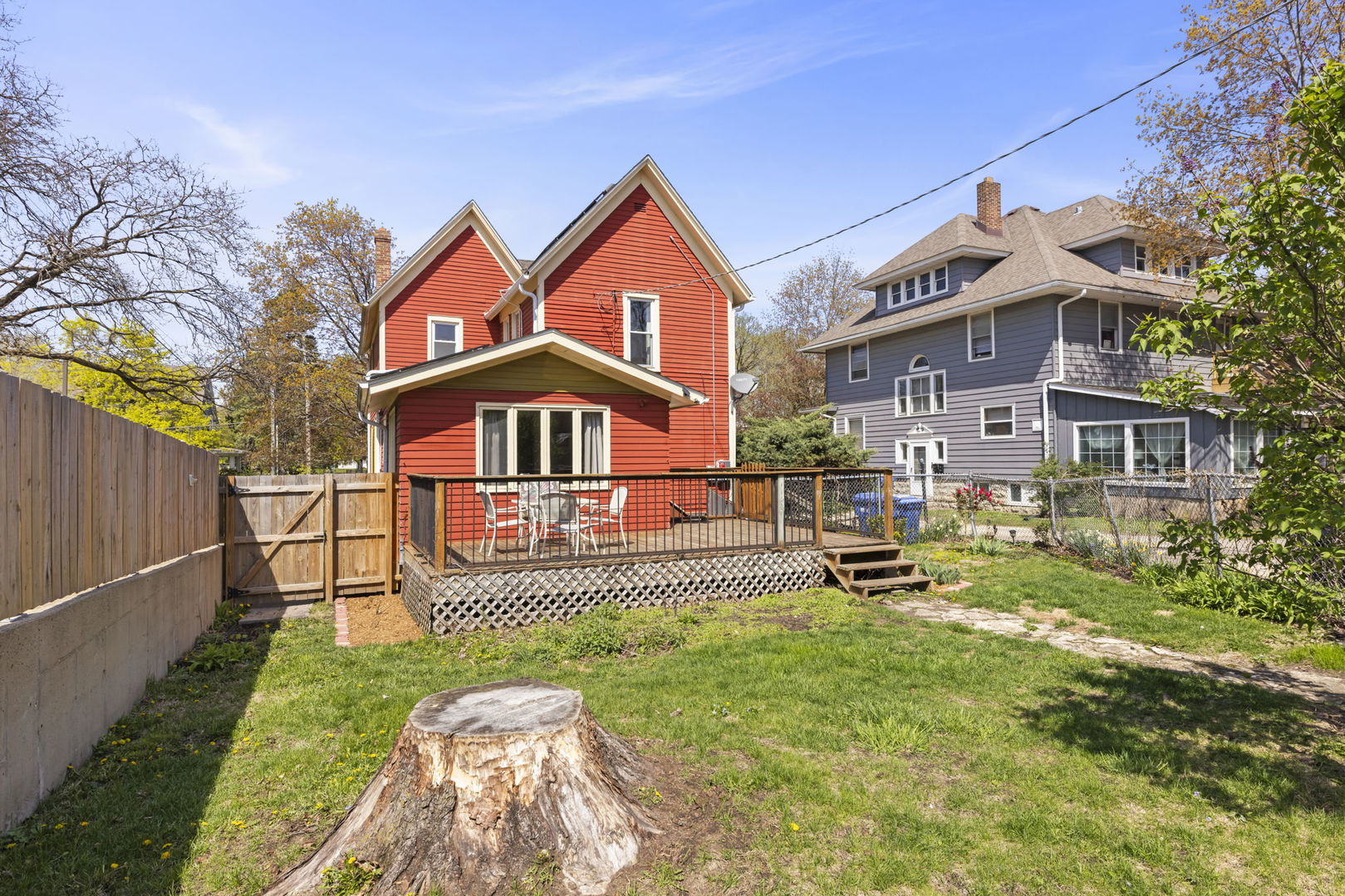 208 West Locust Street DeKalb, IL 60115 - Photo 25 of 26 a front view of a house with a yard table and chairs