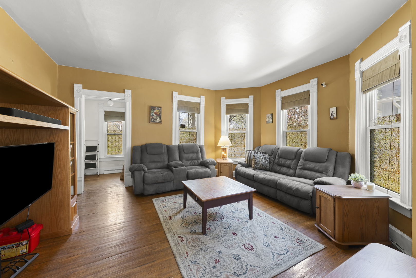 208 West Locust Street DeKalb, IL 60115 - Photo 6 of 26 a living room with furniture and a fireplace