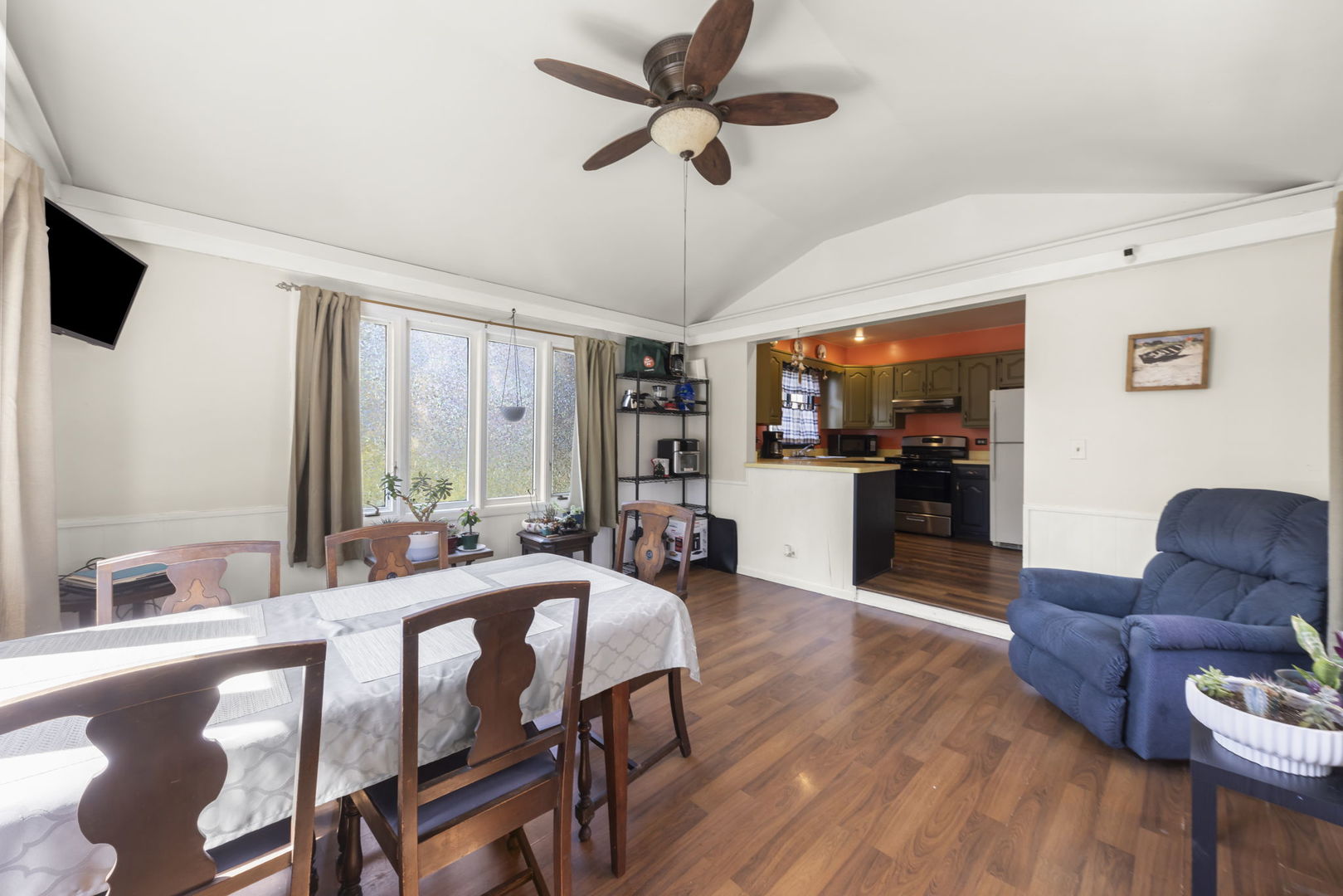 208 West Locust Street DeKalb, IL 60115 - Photo 8 of 26 a view of a dining room with furniture window and wooden floor