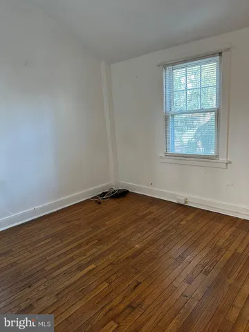 a view of a room with shelf on the wall