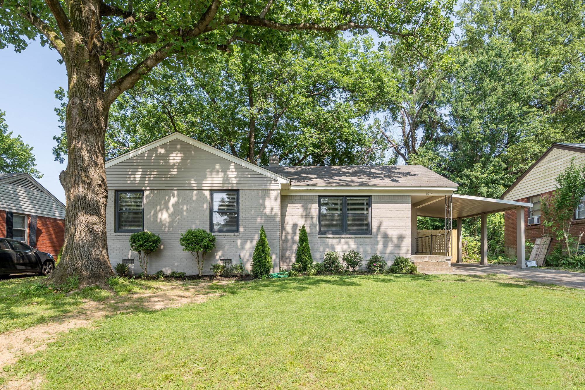 1014 Wellsville Road Memphis, TN 38117 - Photo 1 of 25 a front view of house with yard and green space