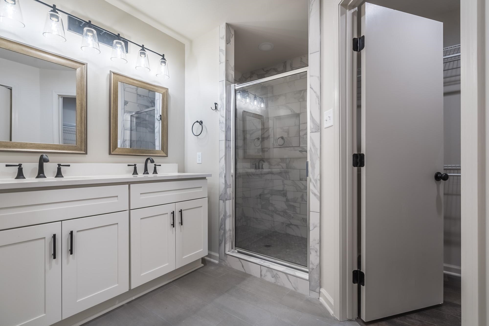 1014 Wellsville Road Memphis, TN 38117 - Photo 15 of 25 a bathroom with a shower sink and mirror