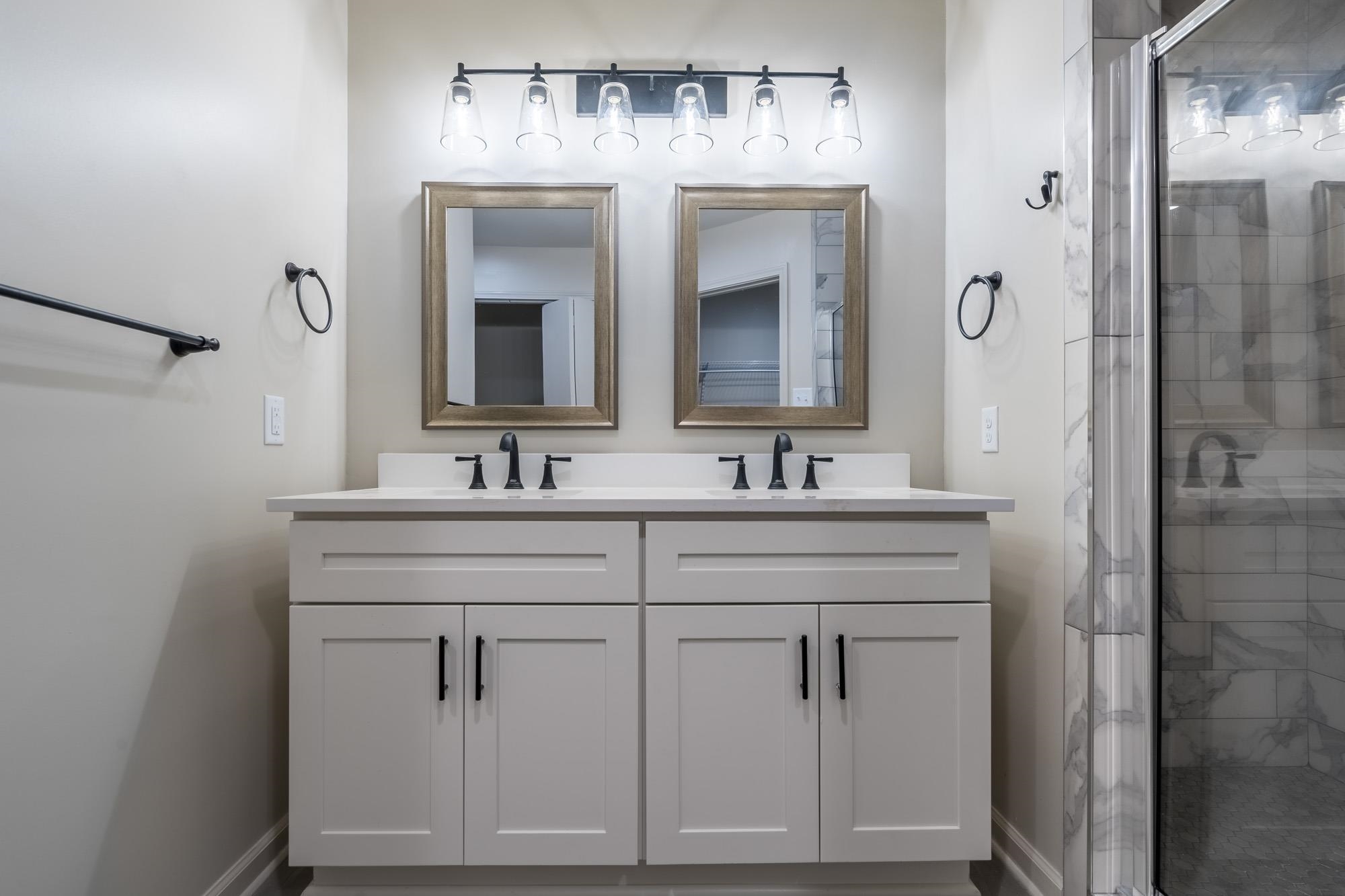 1014 Wellsville Road Memphis, TN 38117 - Photo 16 of 25 a bathroom with a sink vanity and a mirror